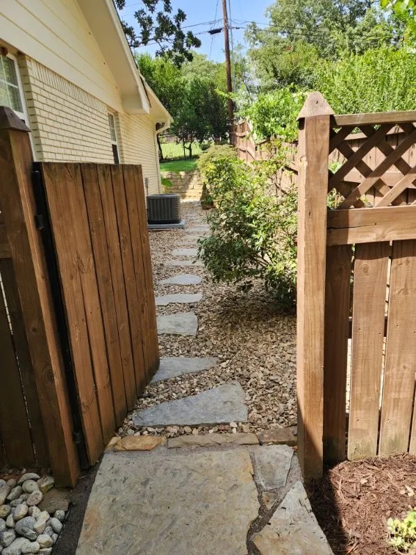 Flagstone path with river rock and hydrangea planting