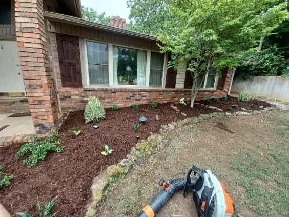 Refreshed mulch beds and planting after a spring cleanup