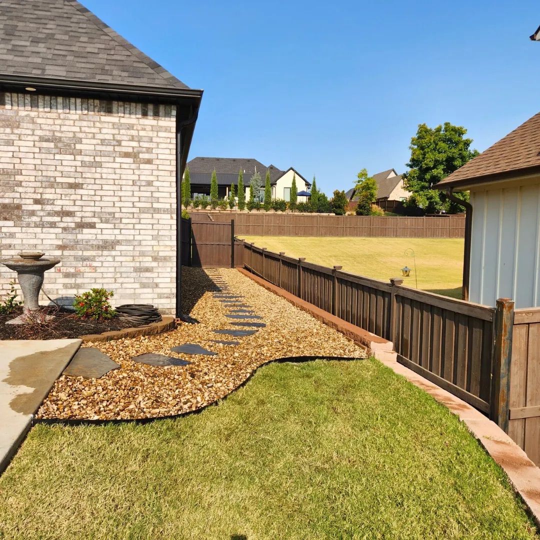 River rock path with stepping stones and fresh sod