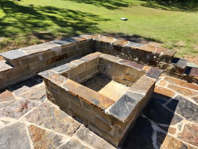 Custom square stone fire pit with flagstone masonry